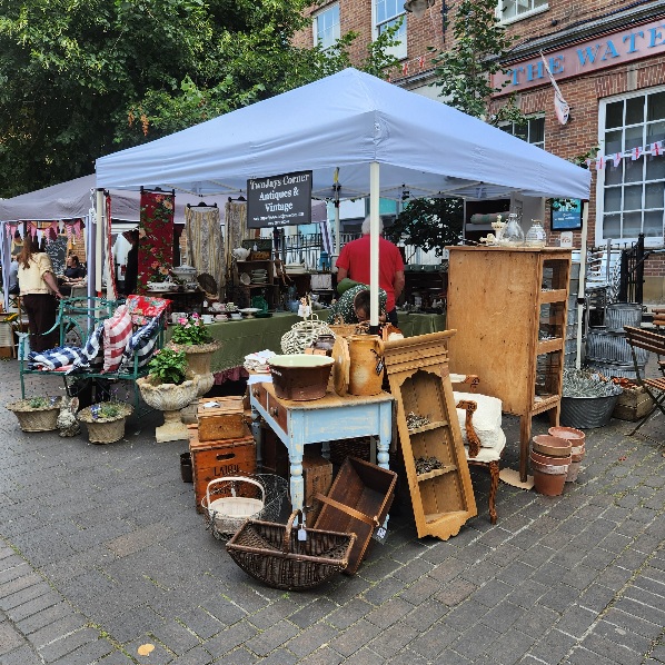 Whitchurch Vide Grenier stand
                                showing antiques on sale
